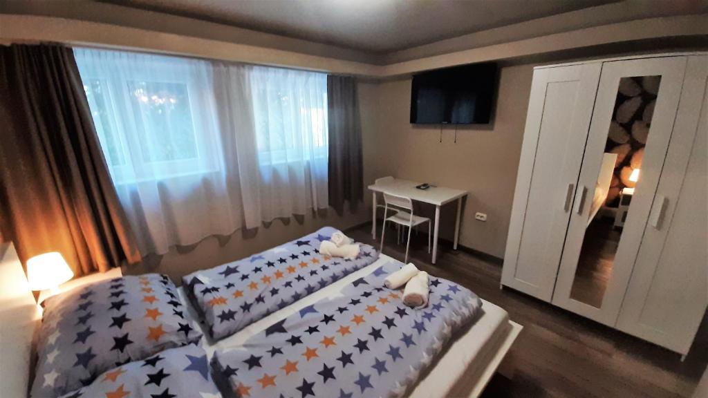 Postel nebo postele na pokoji v ubytování Zöldház Panzió