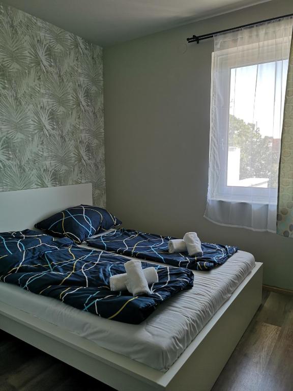 Postel nebo postele na pokoji v ubytování Zöldház Panzió