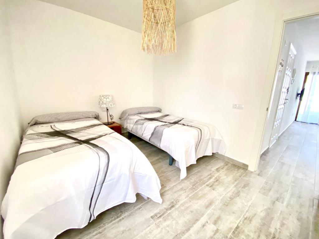 Postel nebo postele na pokoji v ubytování Modern apartment with sea views in Corralejo
