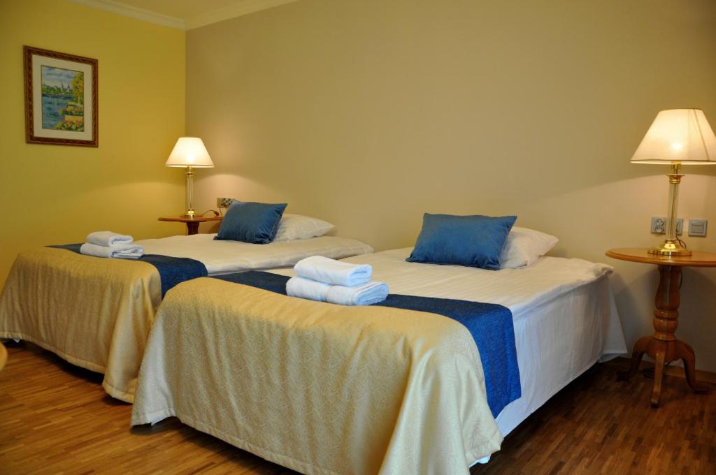 Postel nebo postele na pokoji v ubytování Hotel Mir-Jan SPA