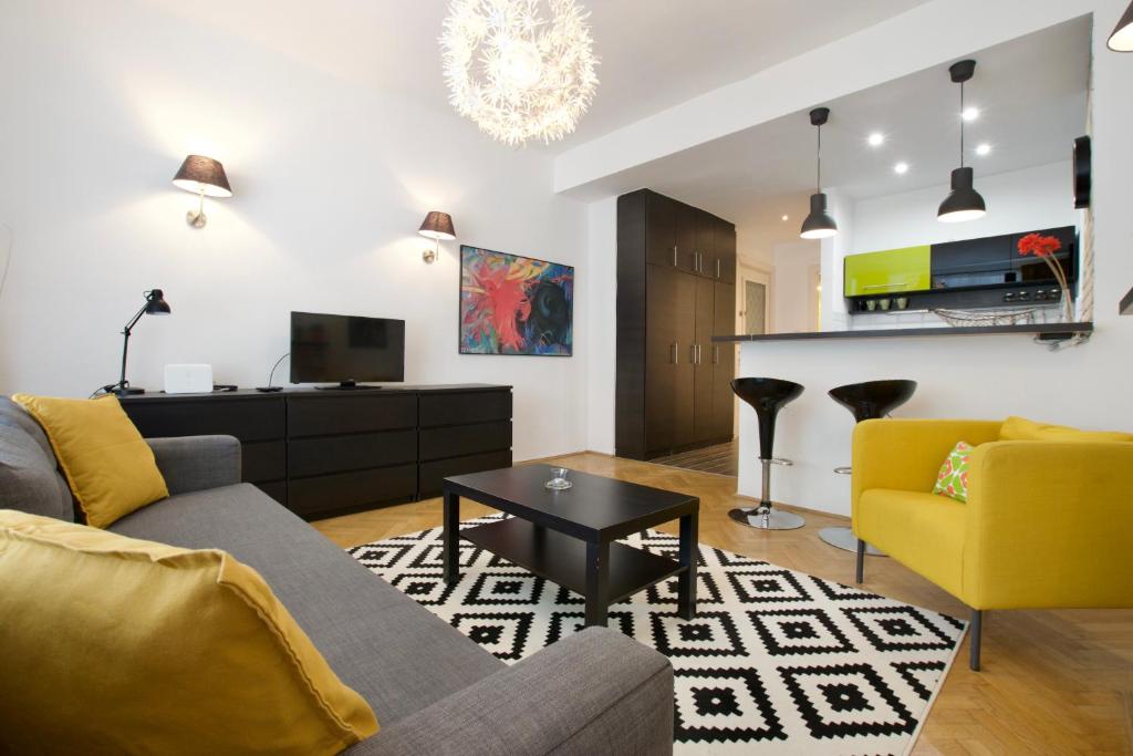 a living room with a couch and a tv at Standard Apartment by Hi5 - Center of city center in Budapest