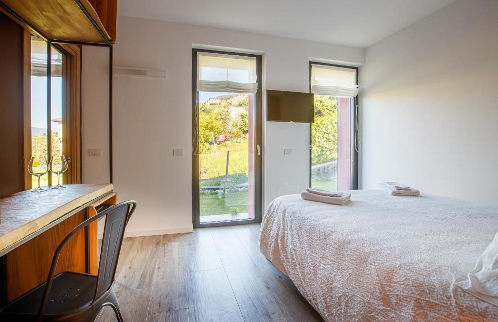 Postel nebo postele na pokoji v ubytování Nebbiolo Wine B&B