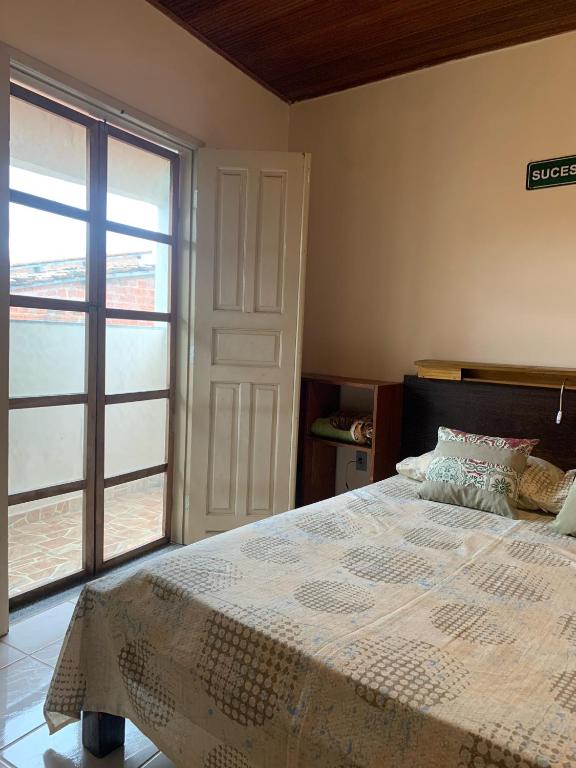 Postel nebo postele na pokoji v ubytování Vila das Estrelas - Guesthouse