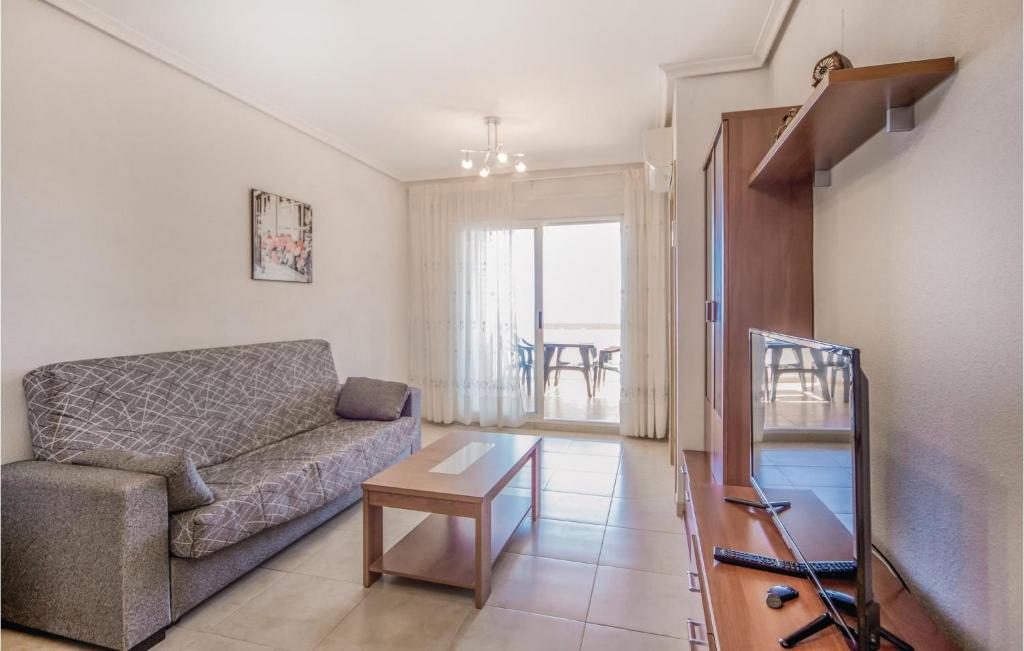 A television and/or entertainment centre at Awesome Apartment In La Torre De La Sal