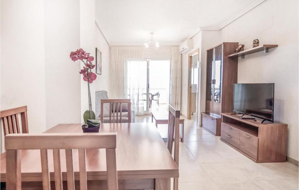 A television and/or entertainment centre at Awesome Apartment In La Torre De La Sal