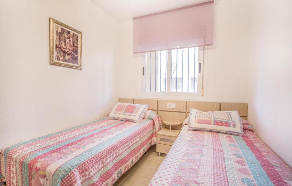 A bed or beds in a room at Awesome Apartment In La Torre De La Sal