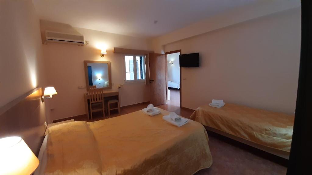 Postel nebo postele na pokoji v ubytování Lassi Hotel
