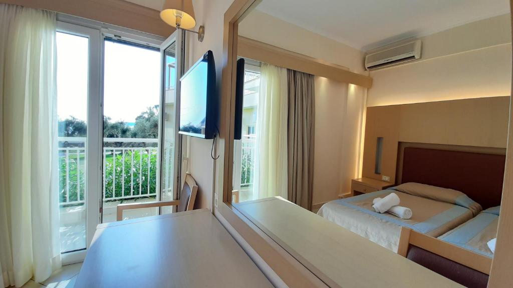 Postel nebo postele na pokoji v ubytování Lassi Hotel