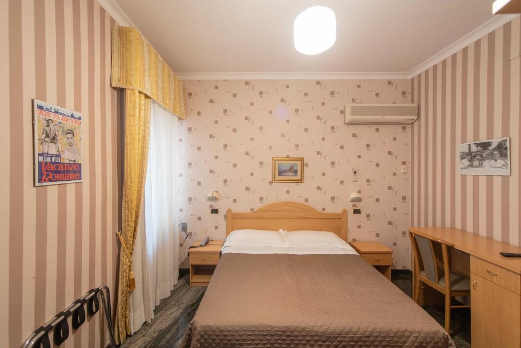 Postel nebo postele na pokoji v ubytování Hotel Siviglia