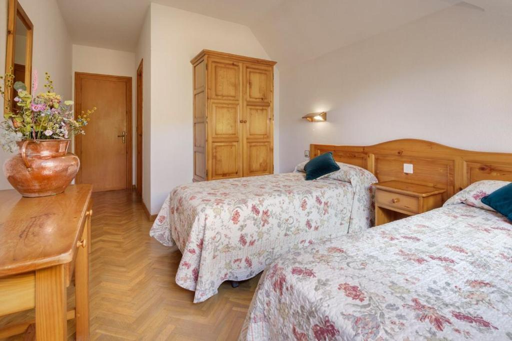 Postel nebo postele na pokoji v ubytování Hotel Lo Foraton
