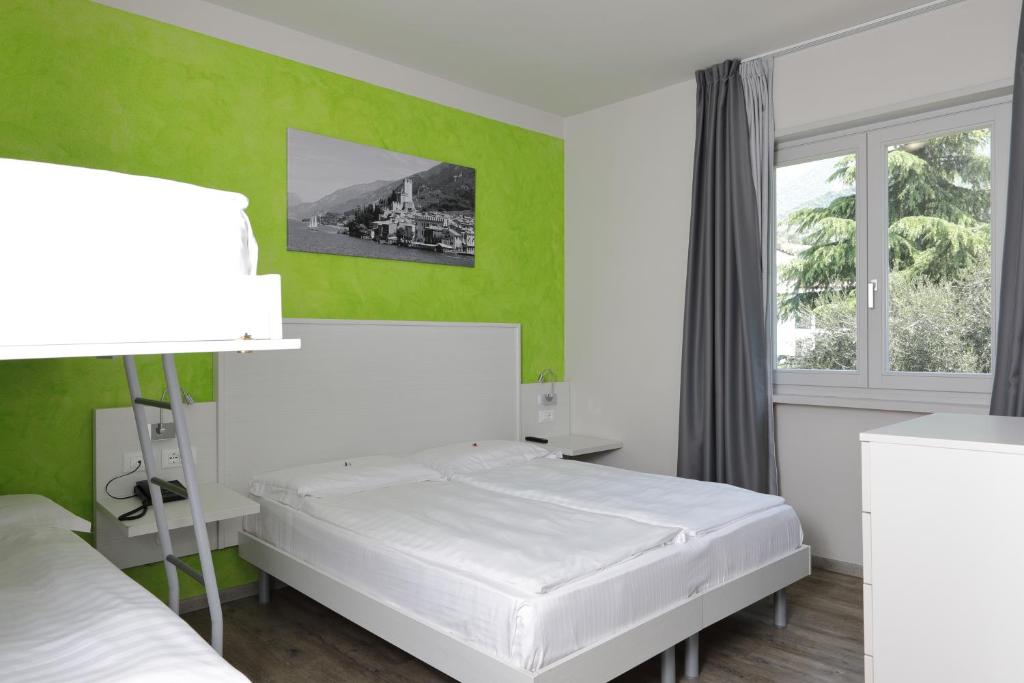 Postel nebo postele na pokoji v ubytování Eco Hotel Benacus
