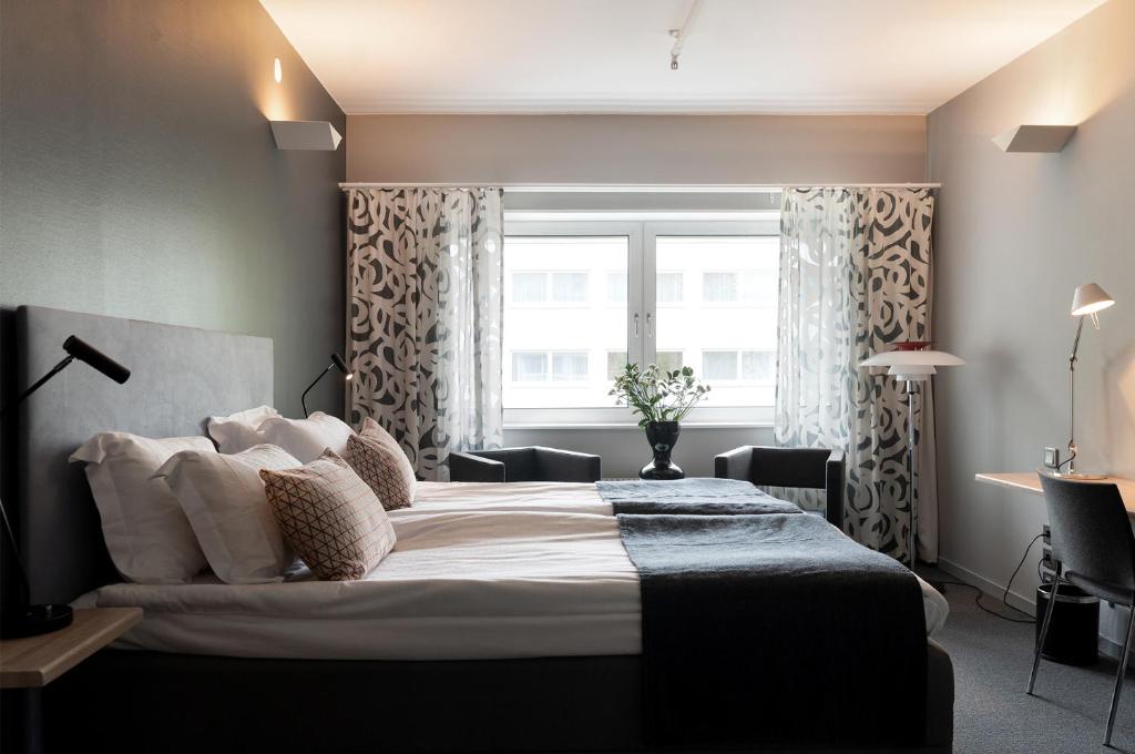 Postel nebo postele na pokoji v ubytování Elite Park Hotel
