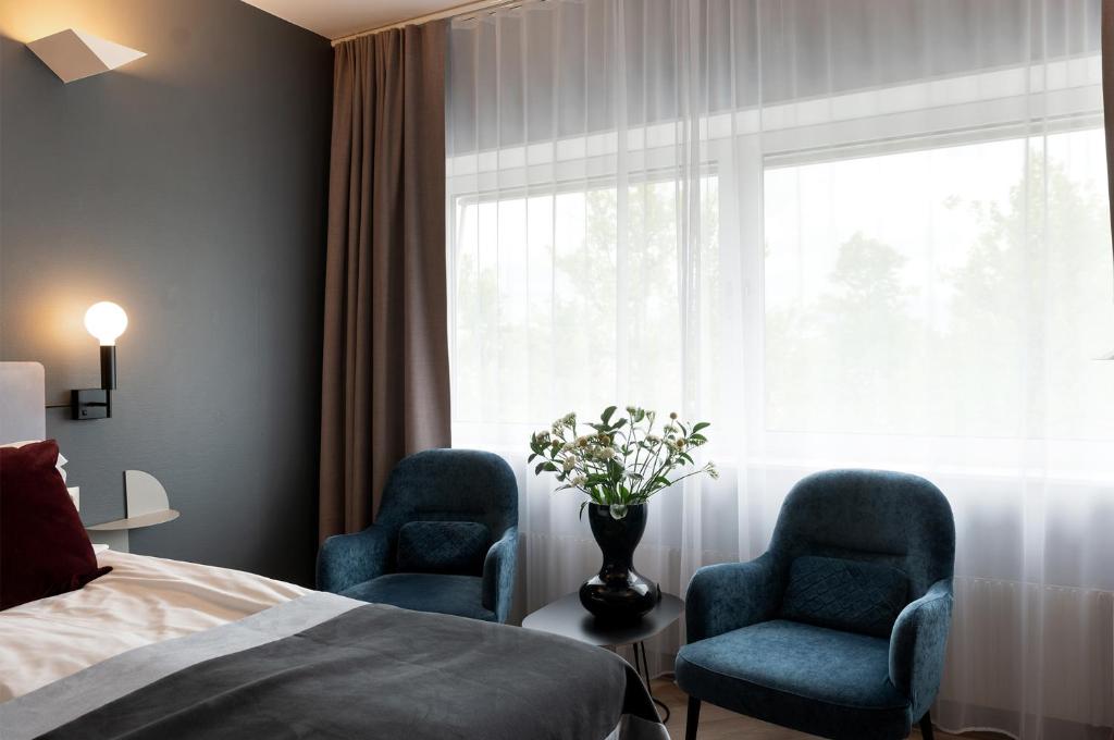 Postel nebo postele na pokoji v ubytování Elite Park Hotel