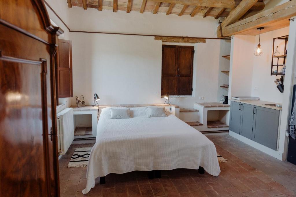 Postel nebo postele na pokoji v ubytování Agriturismo Qui Voglio