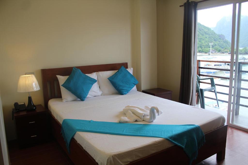 Postel nebo postele na pokoji v ubytování Aqua Travel Lodge