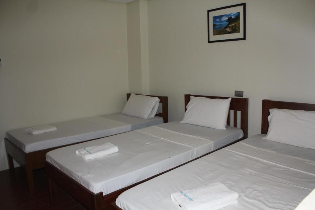 Postel nebo postele na pokoji v ubytování Aqua Travel Lodge