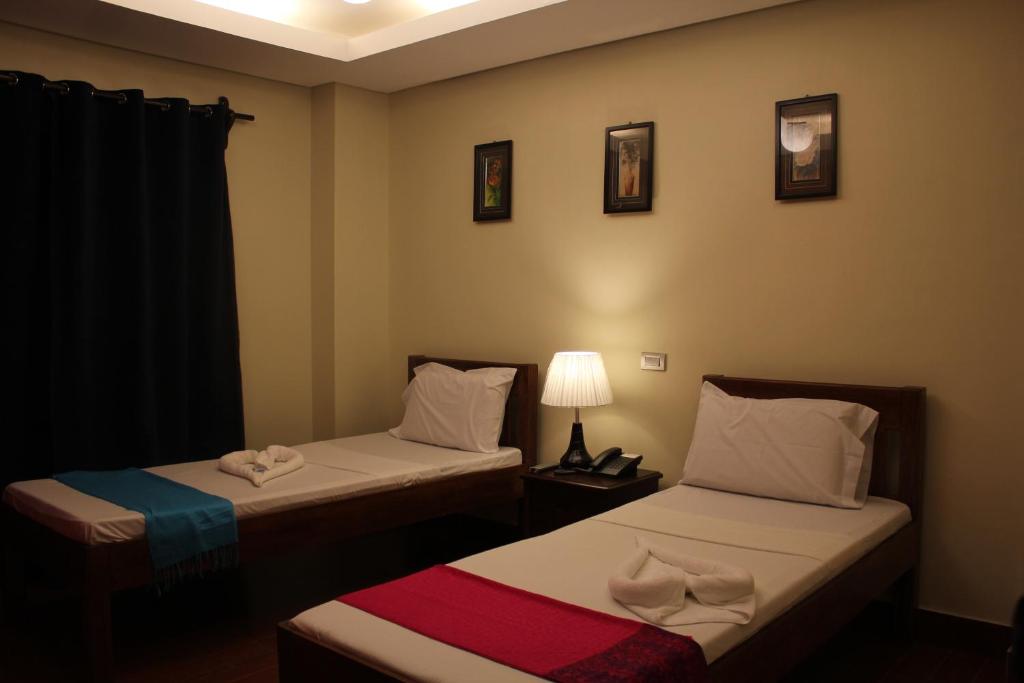 Postel nebo postele na pokoji v ubytování Aqua Travel Lodge