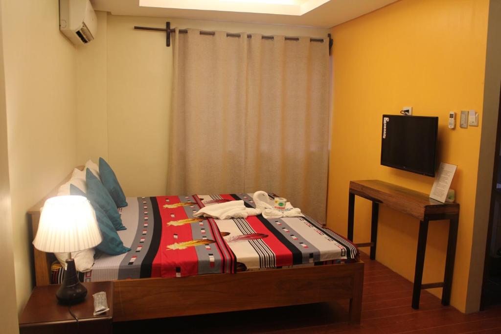 Postel nebo postele na pokoji v ubytování Aqua Travel Lodge