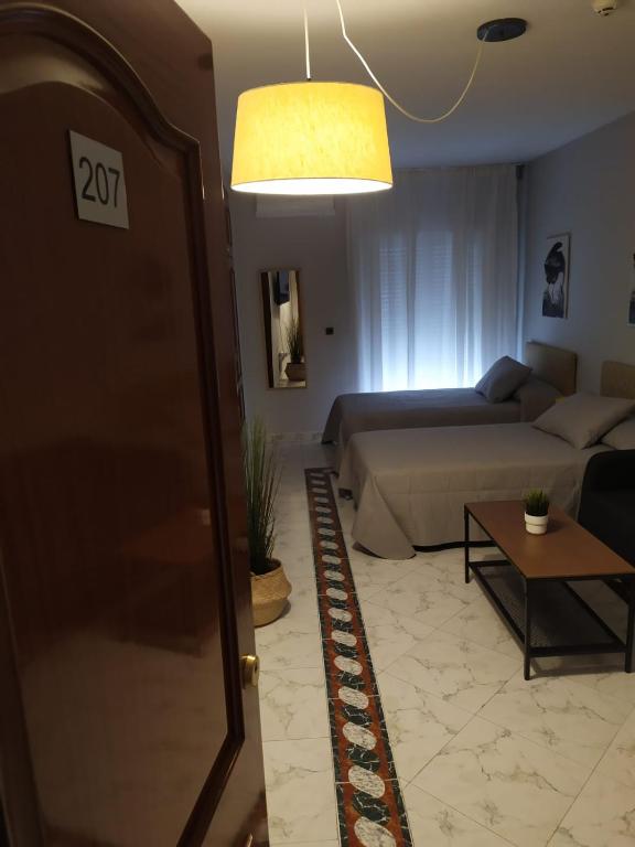 Posezení v ubytování La Palmera Rooms