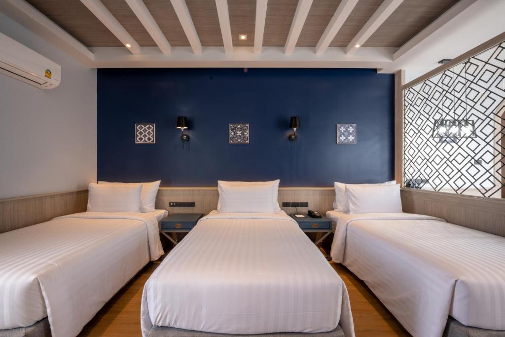 Postel nebo postele na pokoji v ubytování Seabed Grand Hotel Phuket - SHA Extra Plus