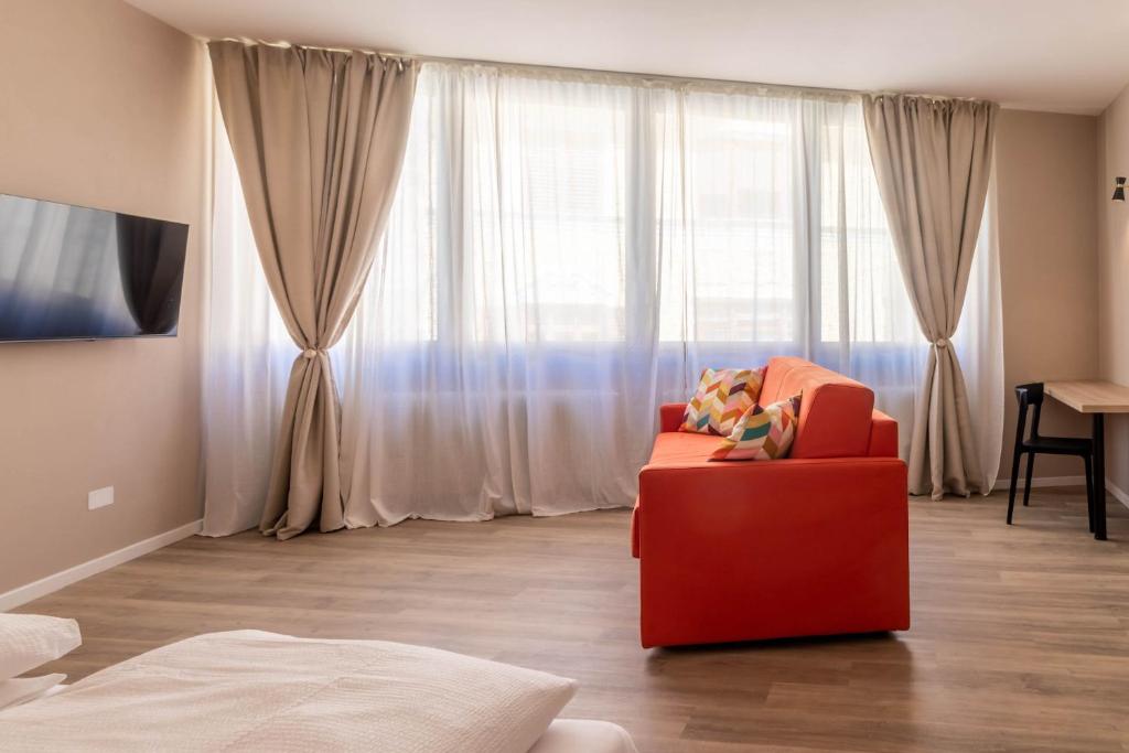Televízia a/alebo spoločenská miestnosť v ubytovaní Apartments Iris