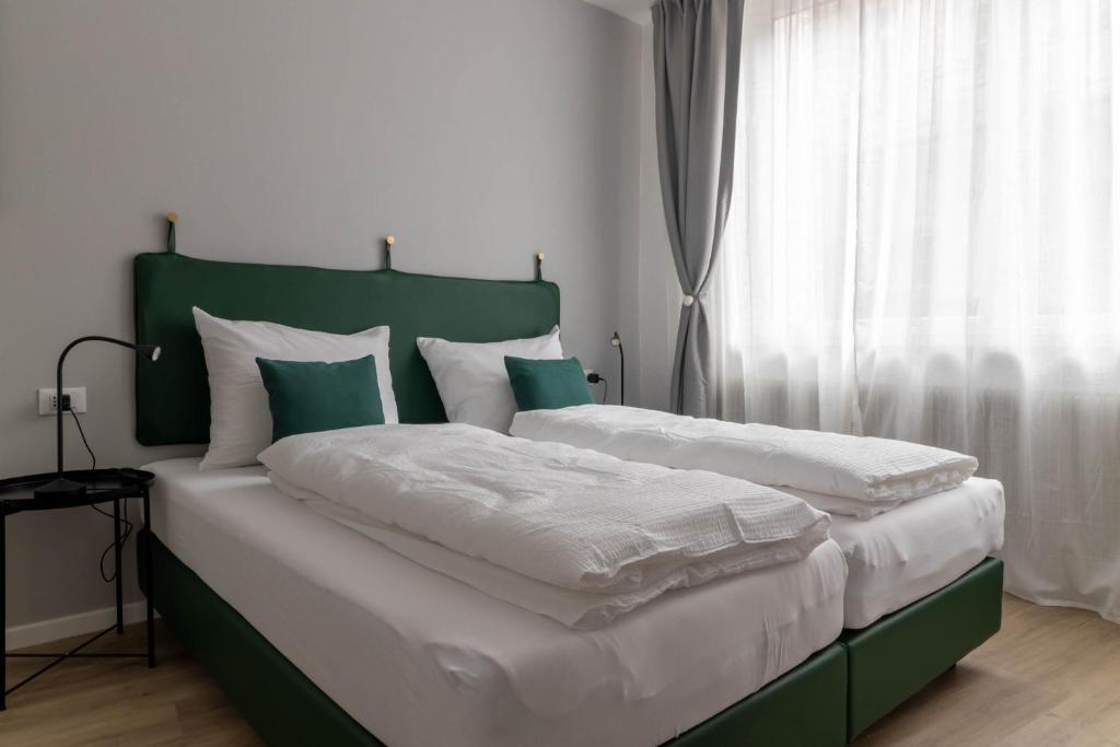 Posteľ alebo postele v izbe v ubytovaní Apartments Iris
