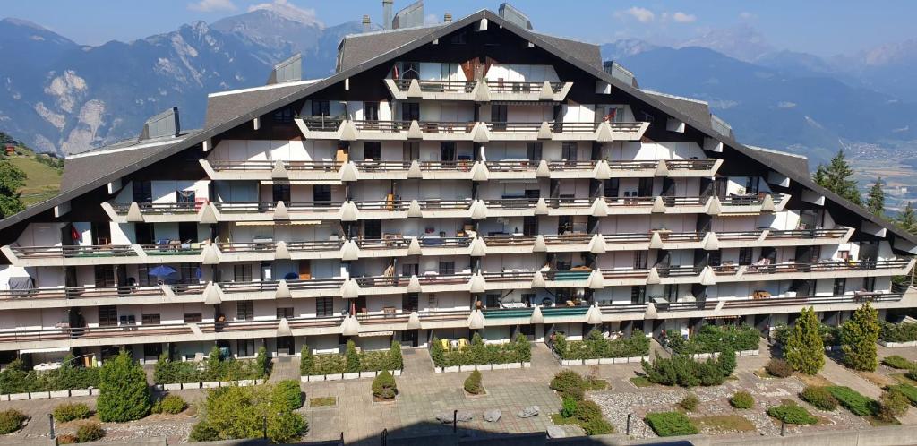 a large building with balconies on the side of it at Résidence « Les Crêtes » in Torgon