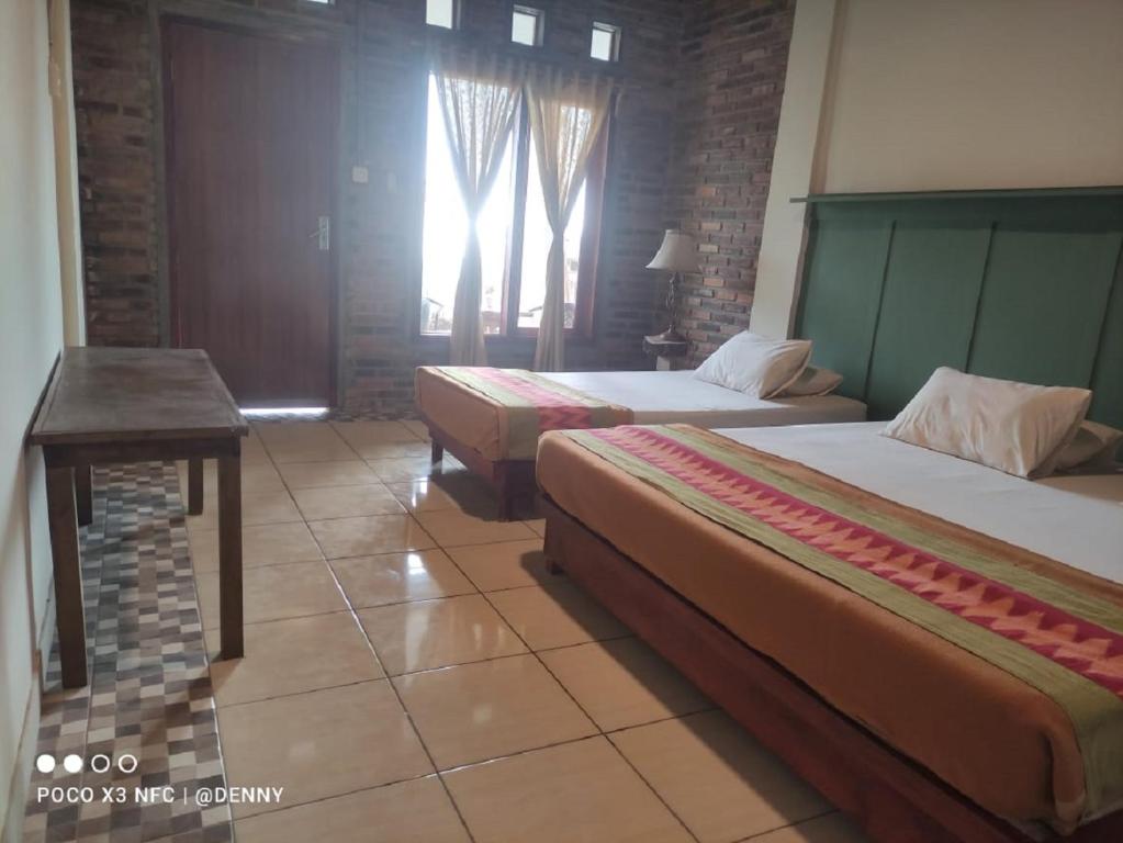 Letto o letti in una camera di Ecobromo