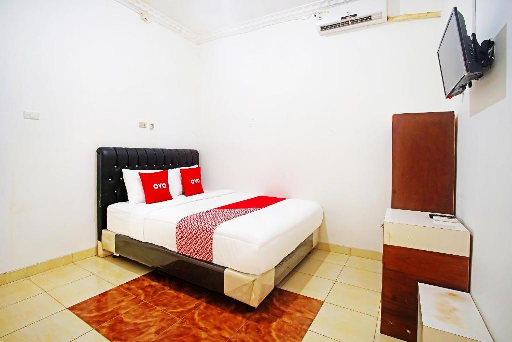 Posteľ alebo postele v izbe v ubytovaní OYO 91460 Guest House Kencana Syariah