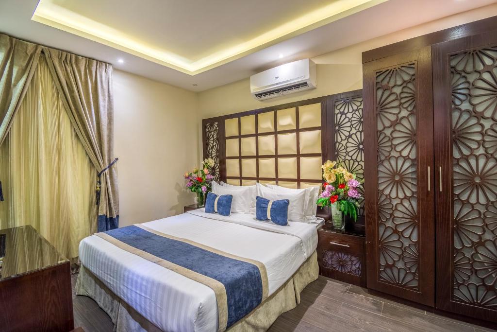 Posteľ alebo postele v izbe v ubytovaní Al Muhaidib Hotel