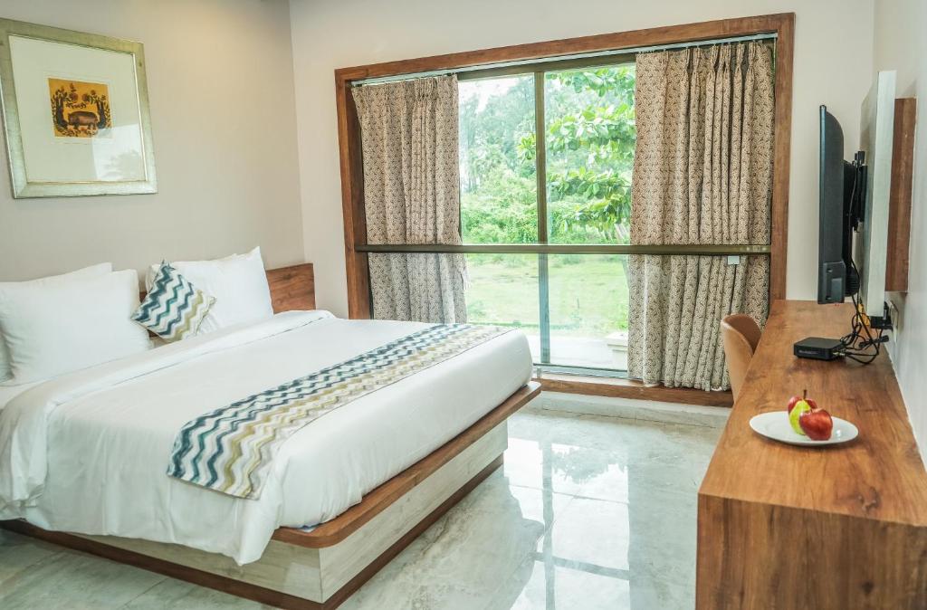 Postel nebo postele na pokoji v ubytování Nest Beacon Resort Daman