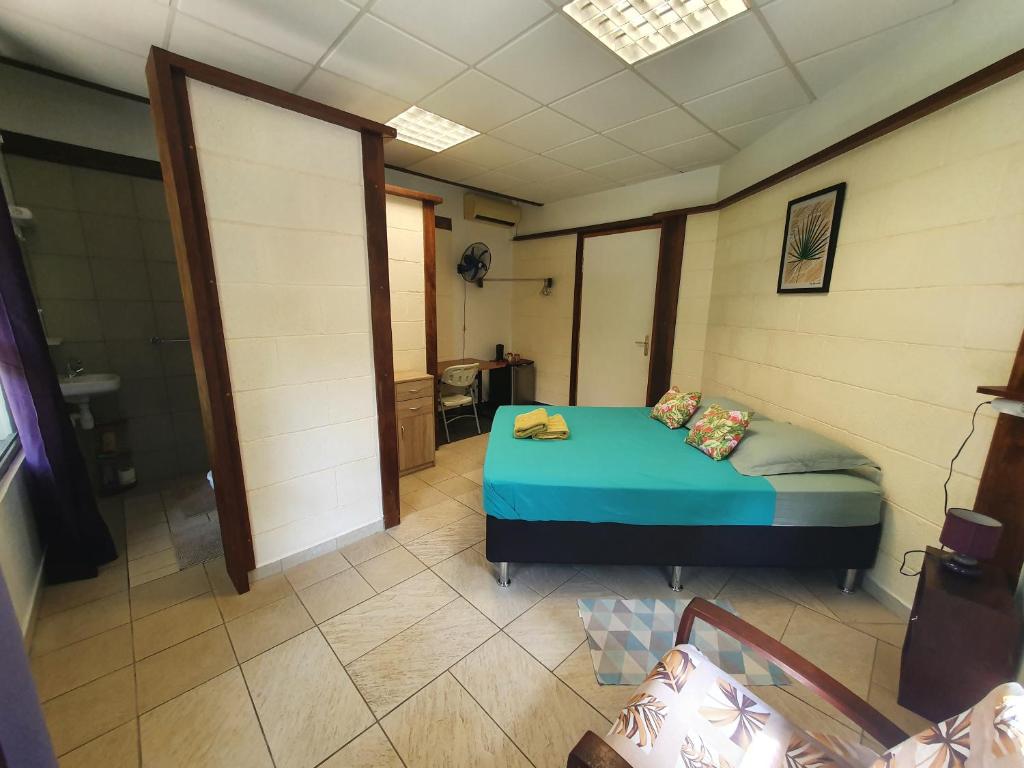 Letto o letti in una camera di Residence Vainau Moorea