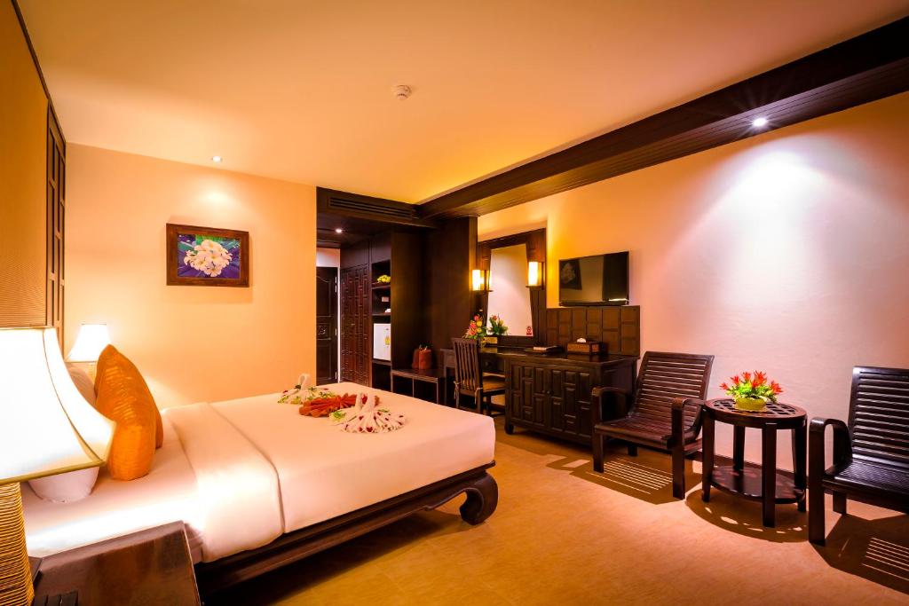 Postel nebo postele na pokoji v ubytování Nipa Resort, Patong Beach - SHA Extra Plus