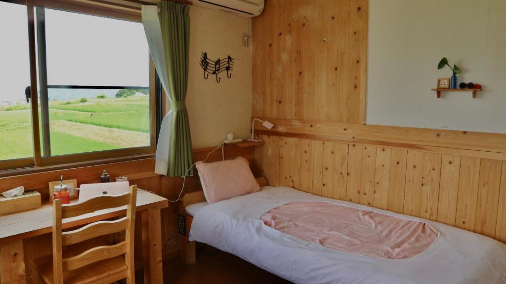 Postel nebo postele na pokoji v ubytování Azumino Backpackers 山の風