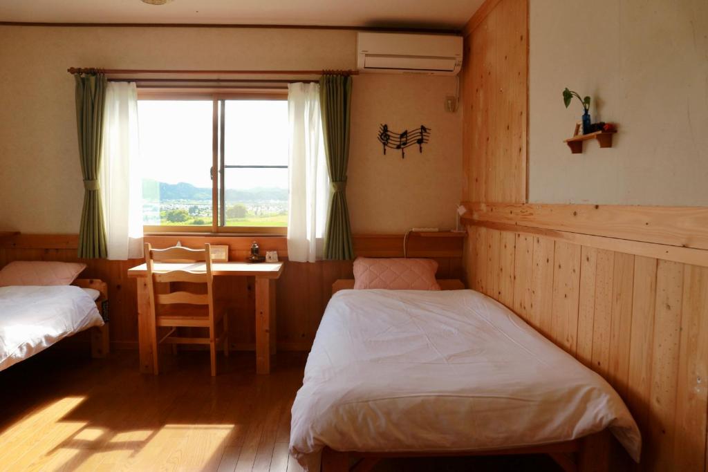 Postel nebo postele na pokoji v ubytování Azumino Backpackers 山の風