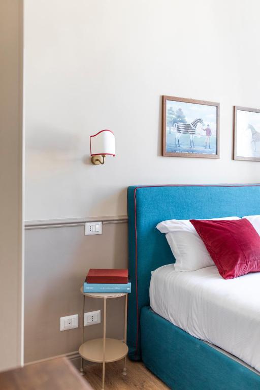 Postel nebo postele na pokoji v ubytování Hotel donna Francesca