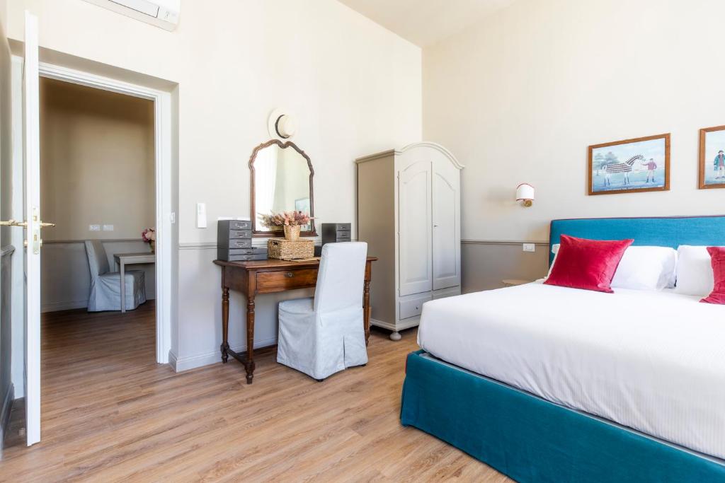 Postel nebo postele na pokoji v ubytování Hotel donna Francesca