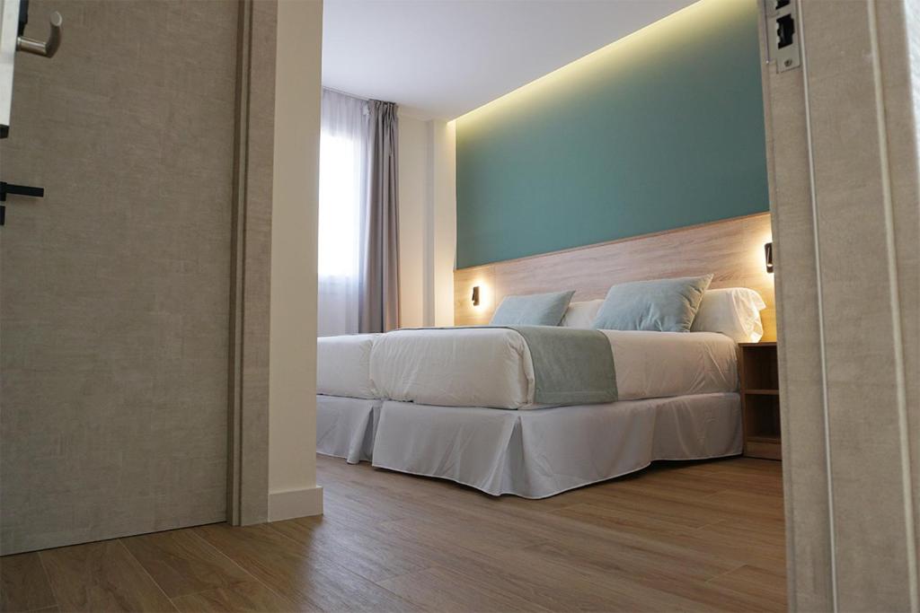 Posteľ alebo postele v izbe v ubytovaní Hotel Don Pepo