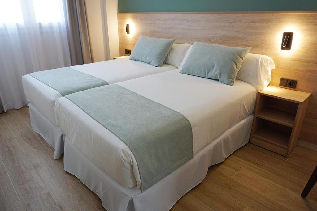 Posteľ alebo postele v izbe v ubytovaní Hotel Don Pepo