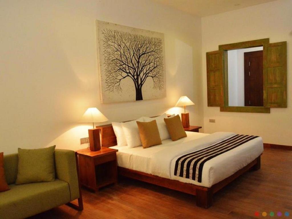 Postel nebo postele na pokoji v ubytování Suriya Resort