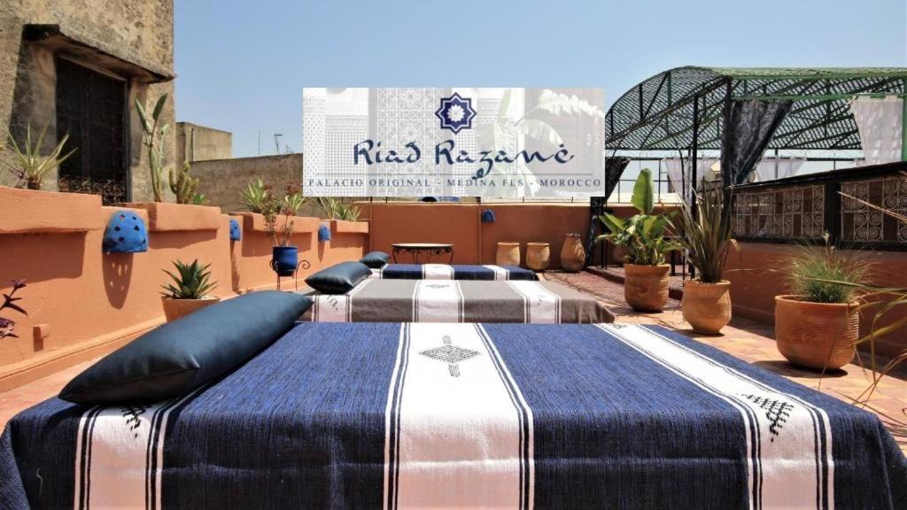 a large bed sitting on top of a roof at Riad Razane Fez in Fès