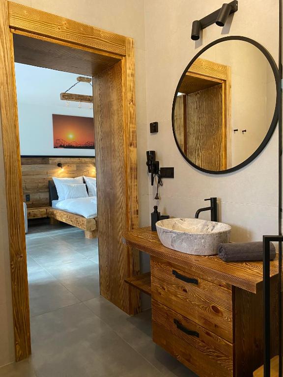 Posteľ alebo postele v izbe v ubytovaní Apartamenty Zander