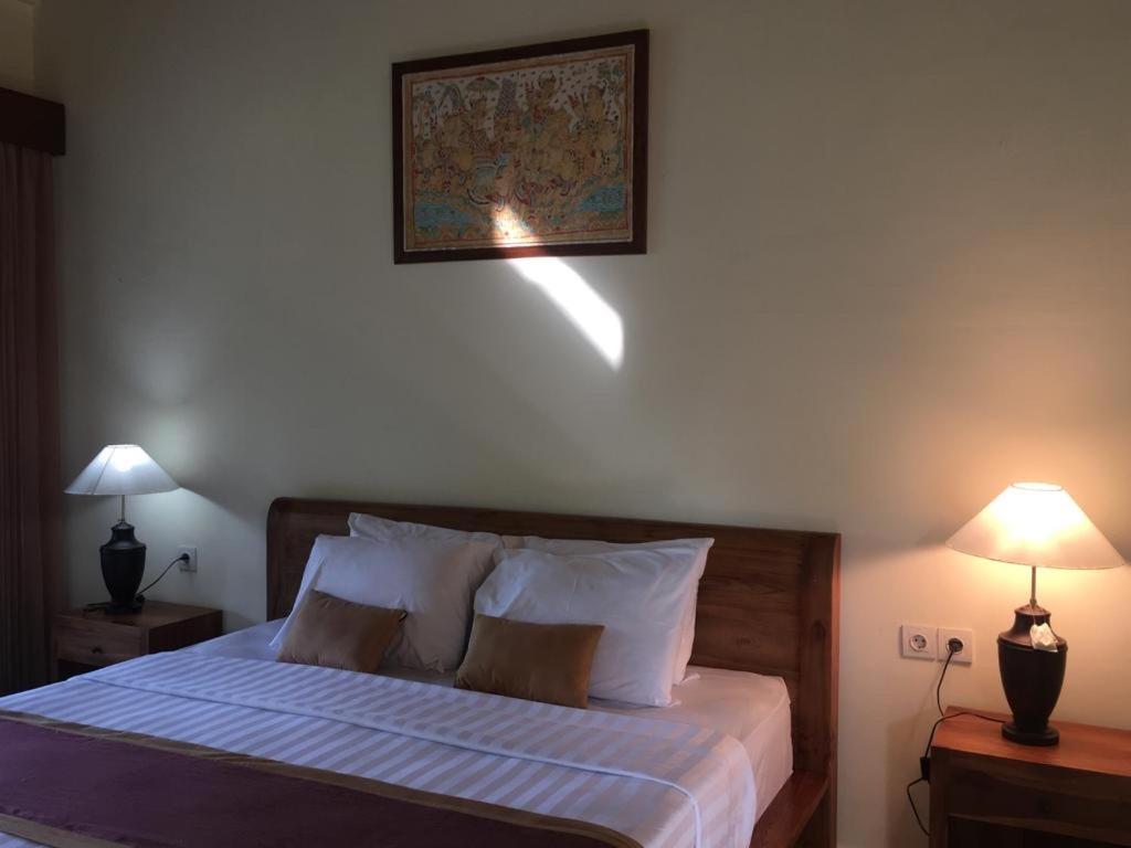 Postel nebo postele na pokoji v ubytování Raka Rai Bungalows