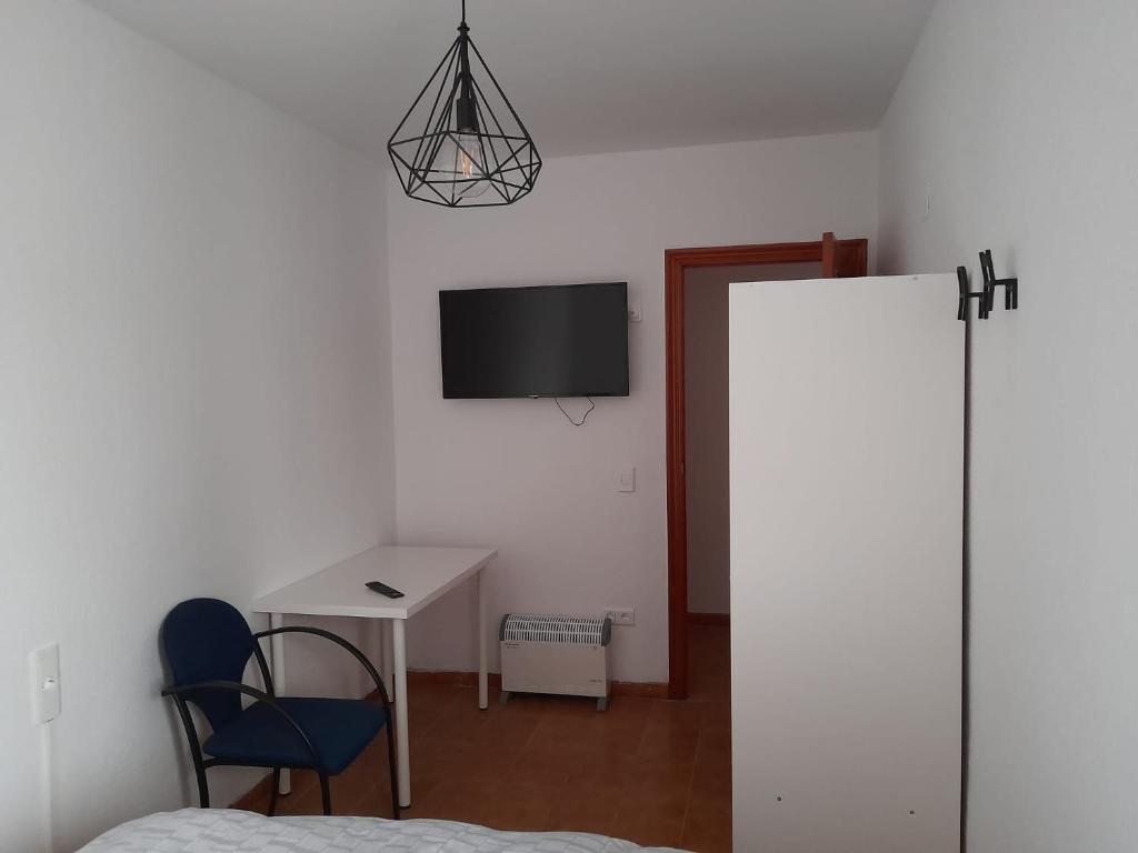 Televízia a/alebo spoločenská miestnosť v ubytovaní Torresmar home