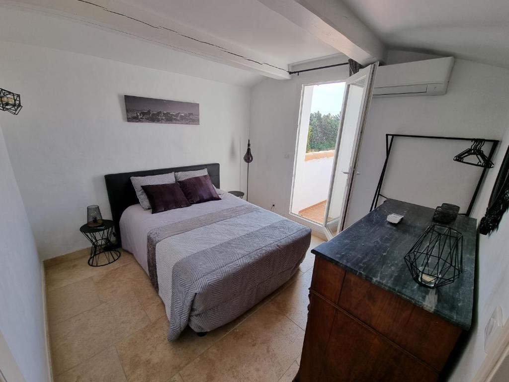 Łóżko lub łóżka w pokoju w obiekcie Domaine du Soleil Couchant