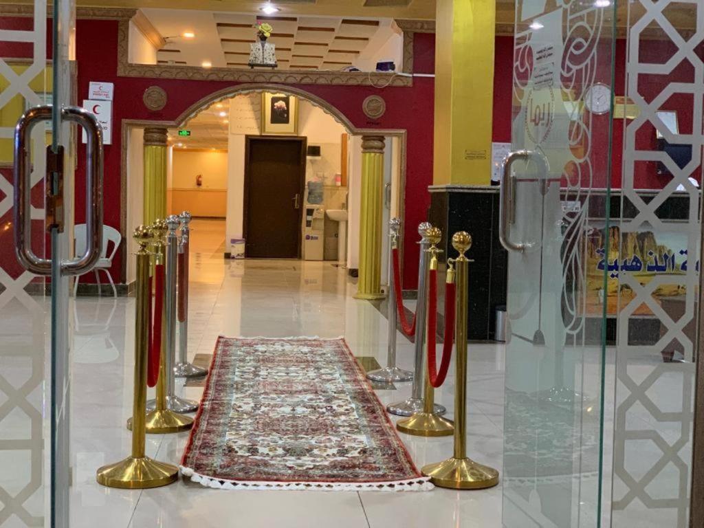 a lobby with a rug on the floor in a building at Golden Quba 1 in Riyadh