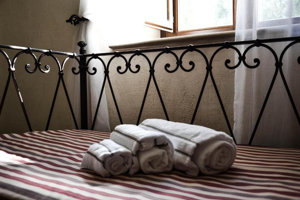 Łóżko lub łóżka w pokoju w obiekcie Relais Sant'Eligio