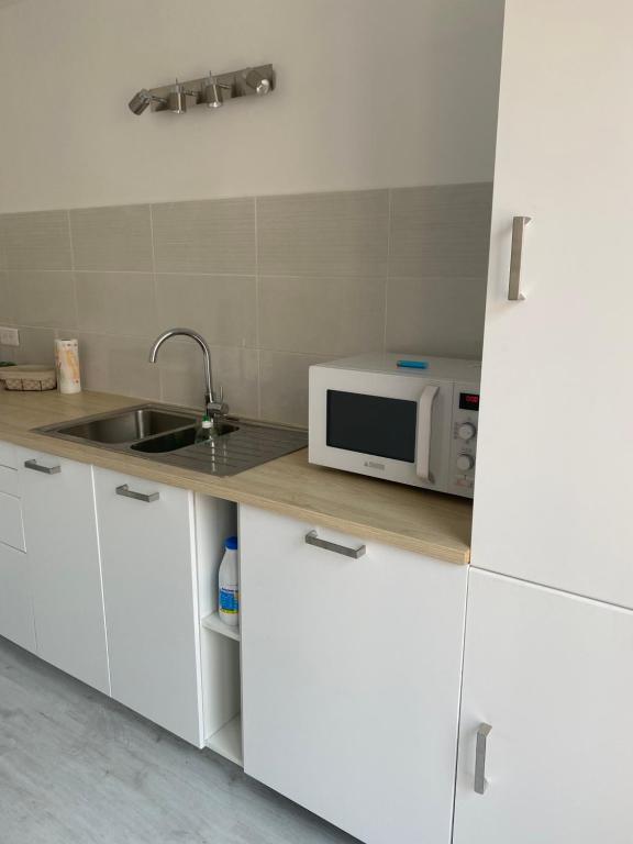 Kuchyňa alebo kuchynka v ubytovaní Superbe appartement climatisé avec parking privé