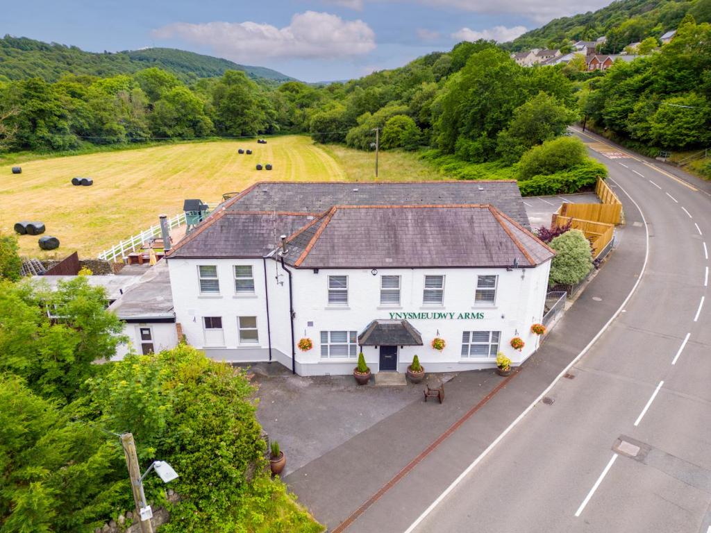 an overhead view of a white building next to a road at Entire Pub Sleeps up to 26 People Swansea - Your Own Pub Experience in Swansea