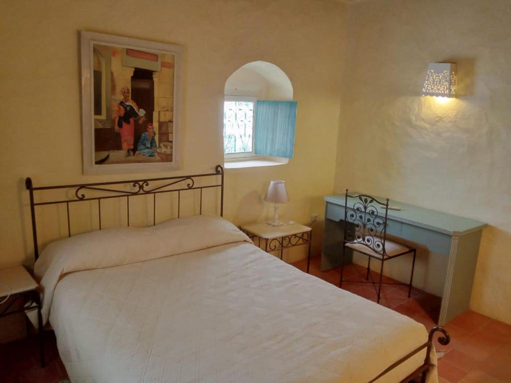 Postel nebo postele na pokoji v ubytování Hotel Dar Dhiafa